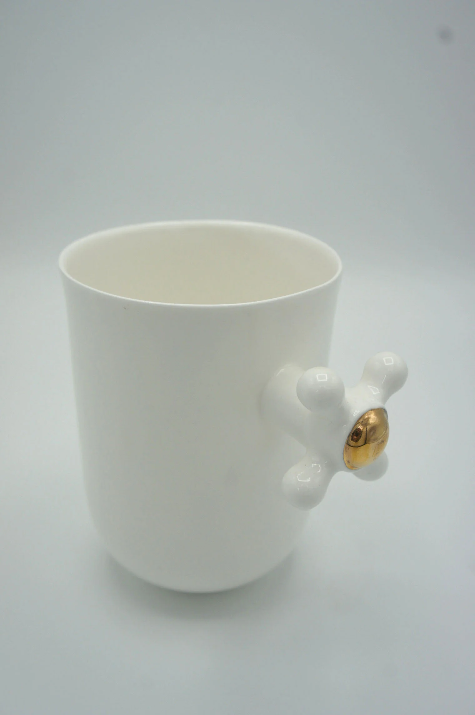 Faucet Cup - Eva Baron Interior Designer in Oxford