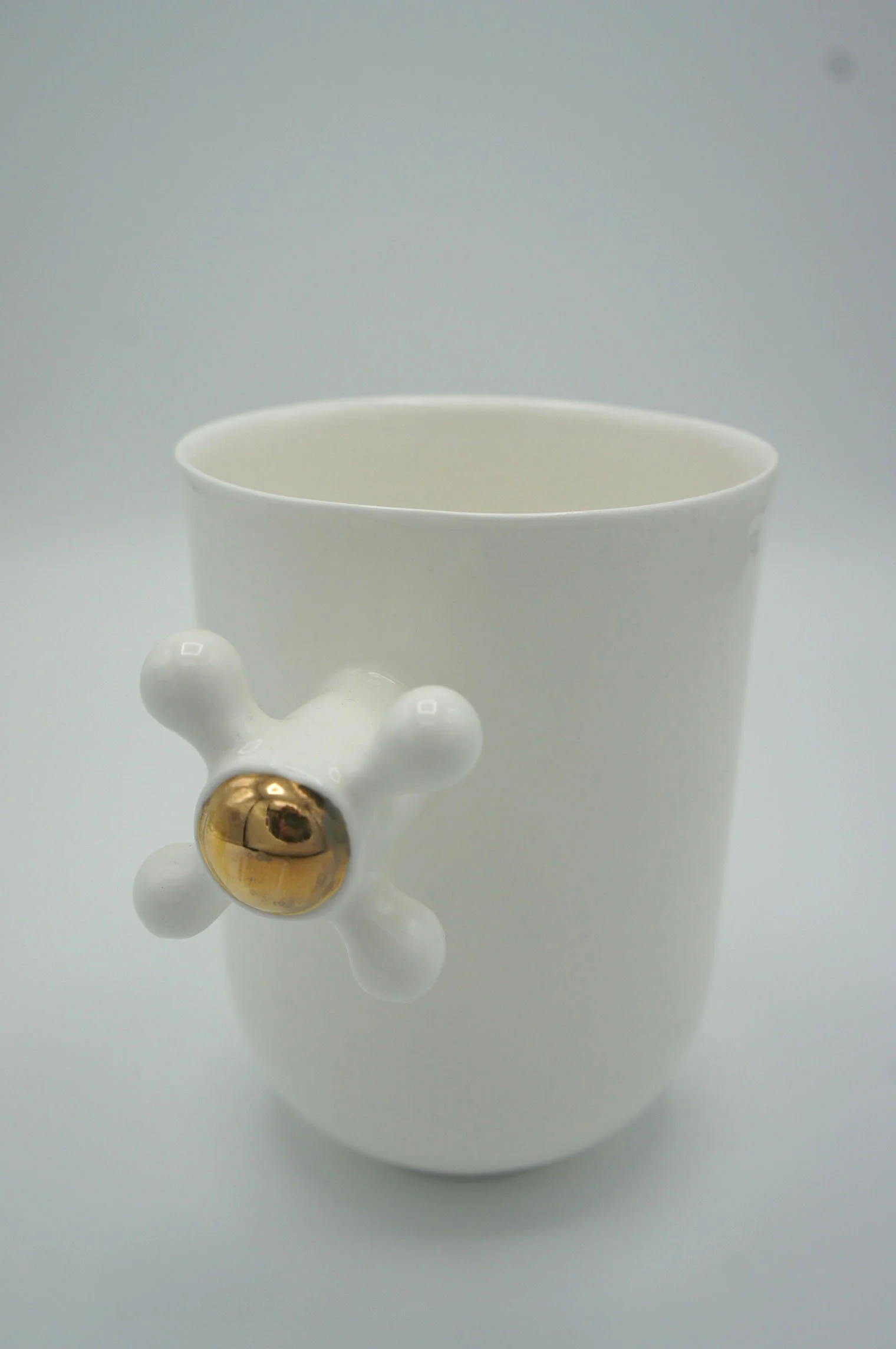 Faucet Cup - Eva Baron Interior Designer in Oxford