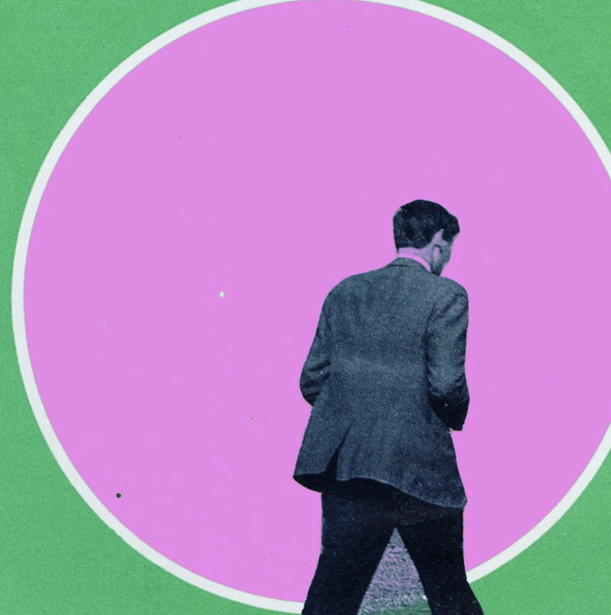 A man in a dark suit walking away from a large pink circle with a green background.