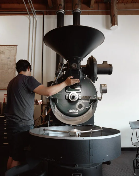Industrial coffee roaster sits the center of the cafe. Image: Neil DaCosta