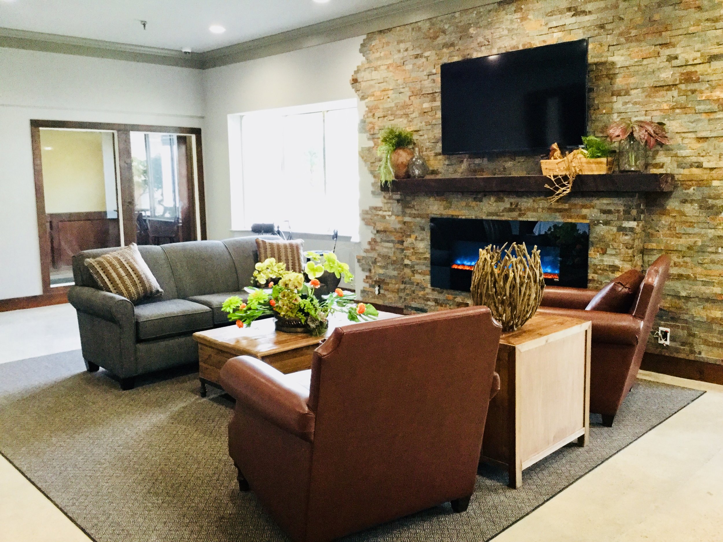 New lobby furniture with fireplace and tv 2018.jpg