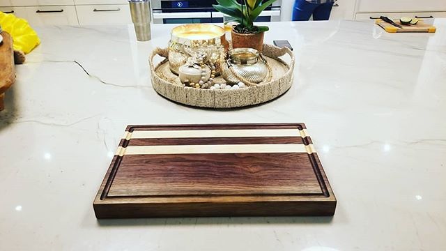 Another custom cutting board made from walnut with maple stripes. This one has a juice groove and inset side handles!
.
#cuttingboard #choppingboard #butcherblock #charcuterieboard #servingboard #walnut  #hardwood #kitchen  #farmhousedecor #farmhouse