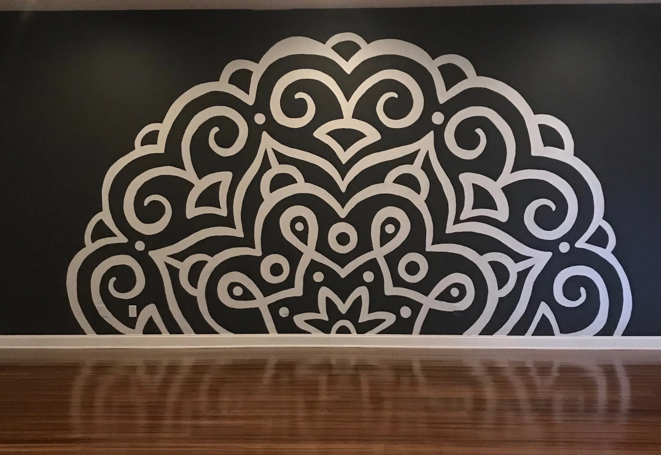 The finished mural on the large wall.