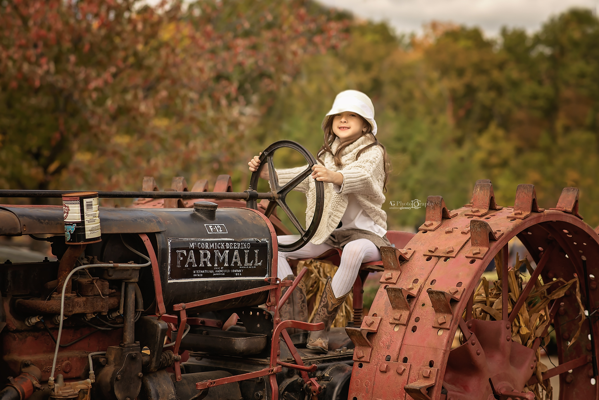 Girl playing on tractor outdoor picture fall session in Bergen County, New Jersey