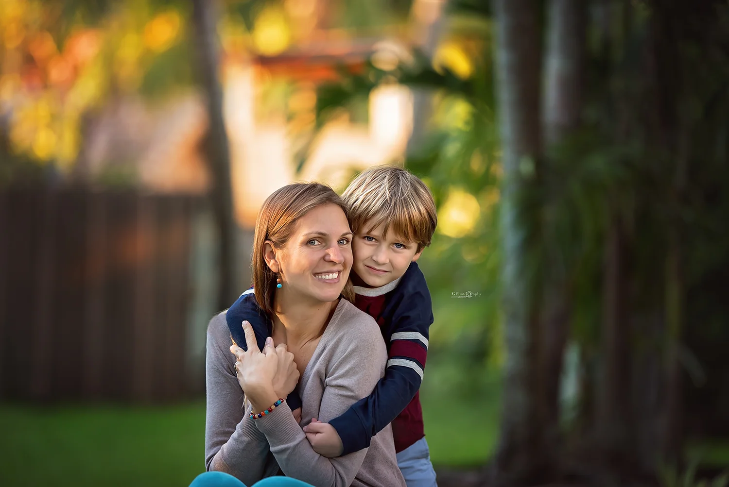 Mom and son posed for a mini and me session