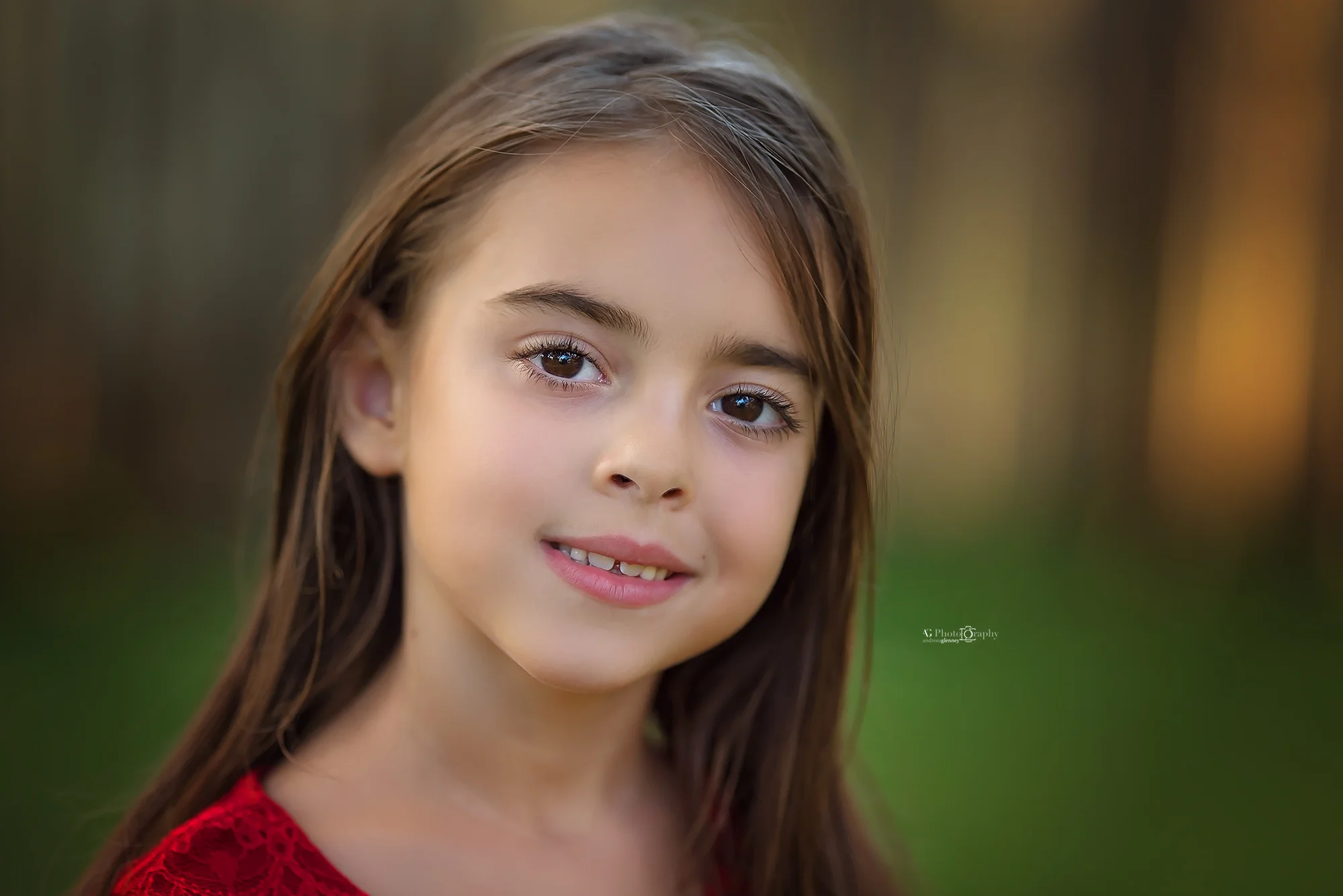 girl-smiling-portrait-outdoor-family-session.jpg