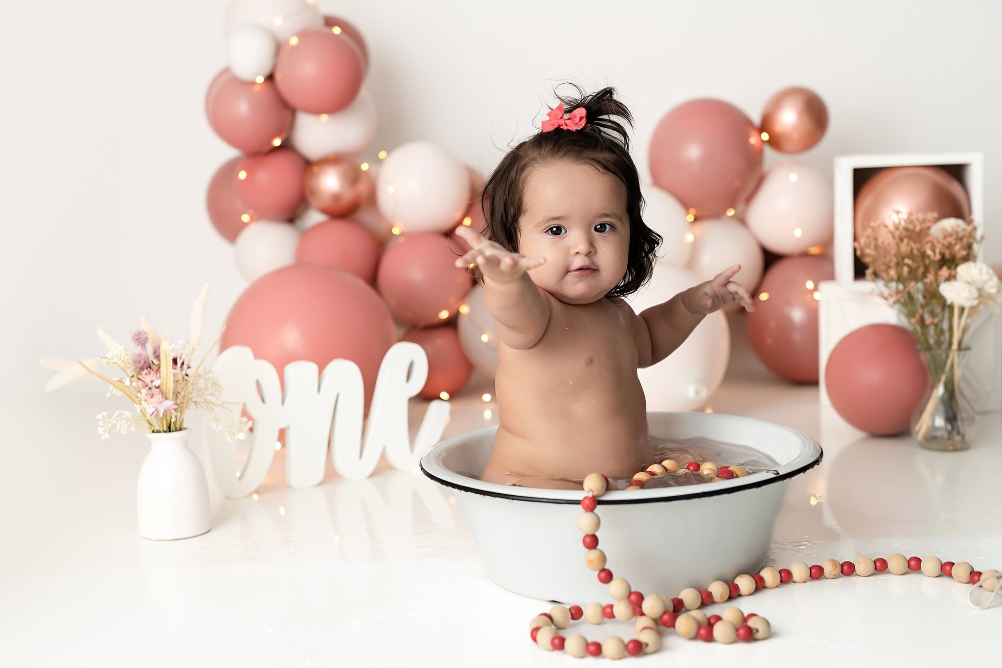 baby-girl-bubble-bath-one-year-old-dusy-rose-white-color-studio-photographer-Alpharetta-best.jpg