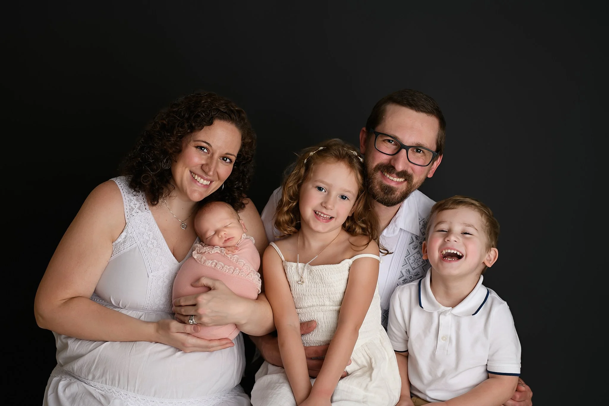Family with a newborn and 2 young kids