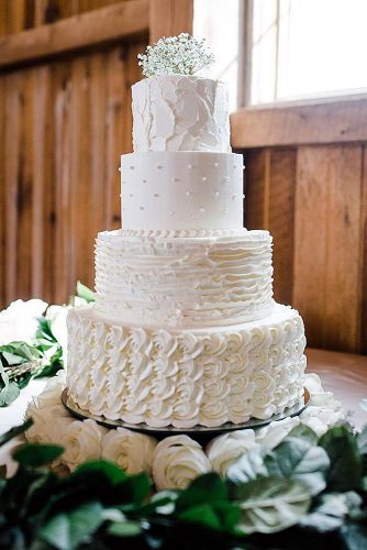 buttercream-wedding-cakes-white-each-level-with-a-different-cream-texture-erin-elaine-schiefen-via-instagram-334x500.jpg