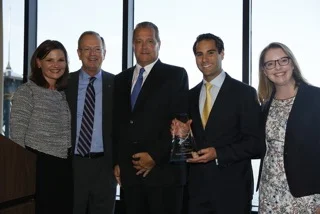 Dennis Murphy, Anthony Abdelahad, and Tierney Flaherty accept the Boys & Girls Clubs of America 2016 Government Affairs Professional of the Year Award, presented by President & CEO Jim Clark.