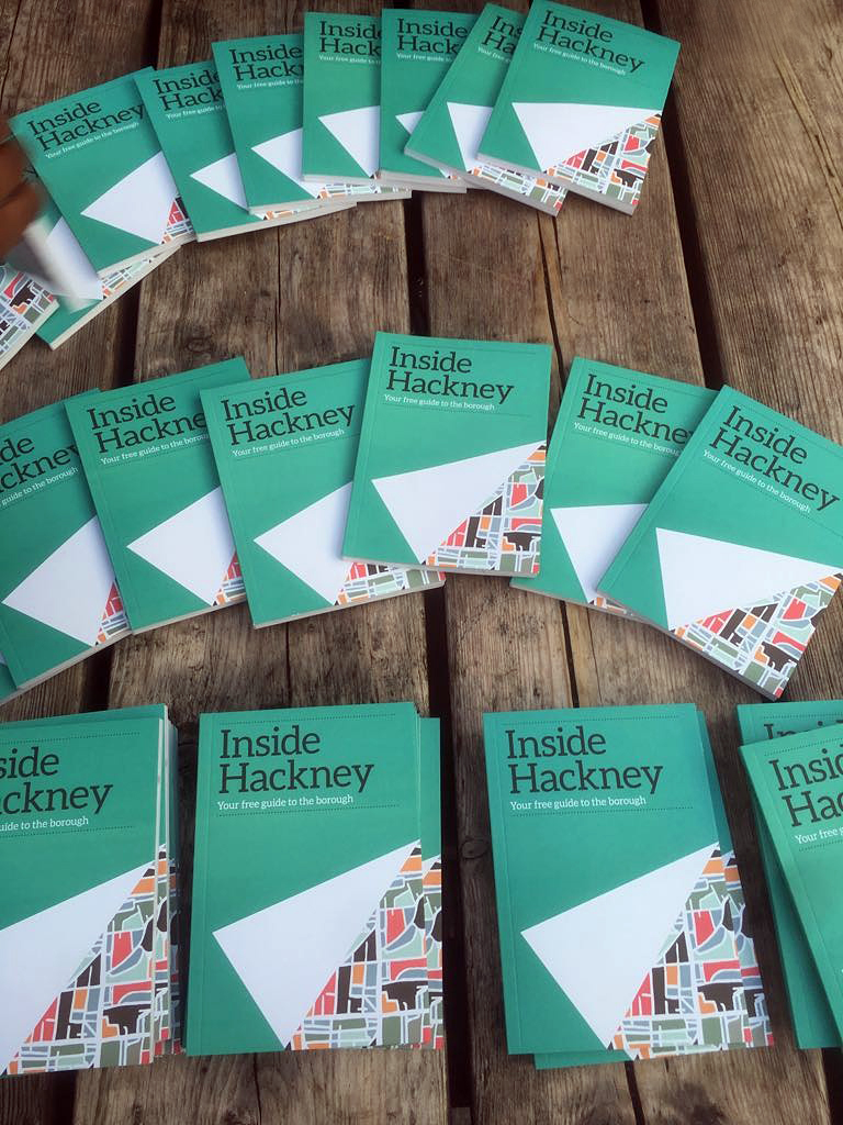 Guides being given away at a community gathering in Gillett Square in Hackney.