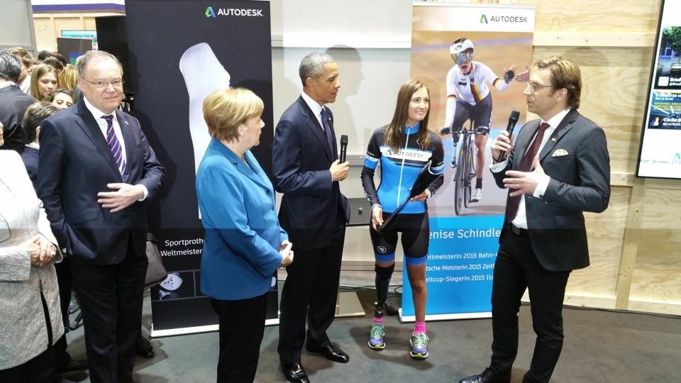 Barack Obama and Angela Merkel meeting Denise Schindler to learn about the prosthetic