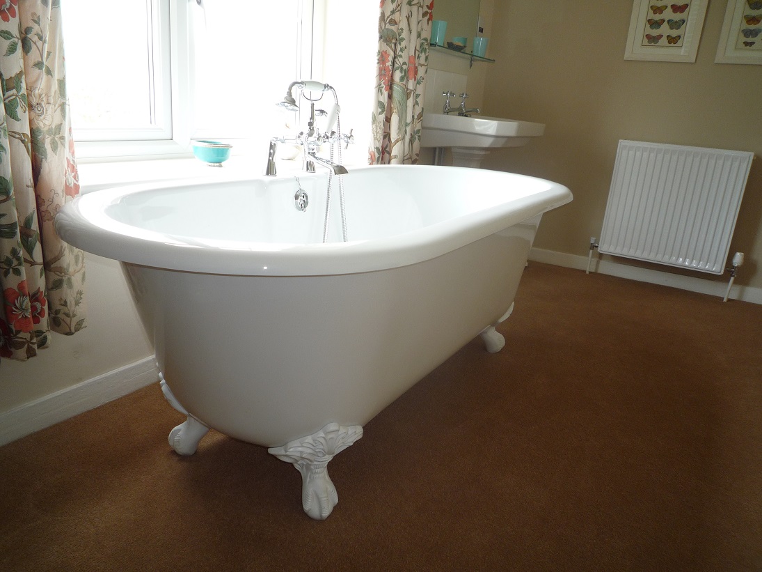 There are seven bathrooms in the house, including this en-suite one which is accessed through a cupboard.