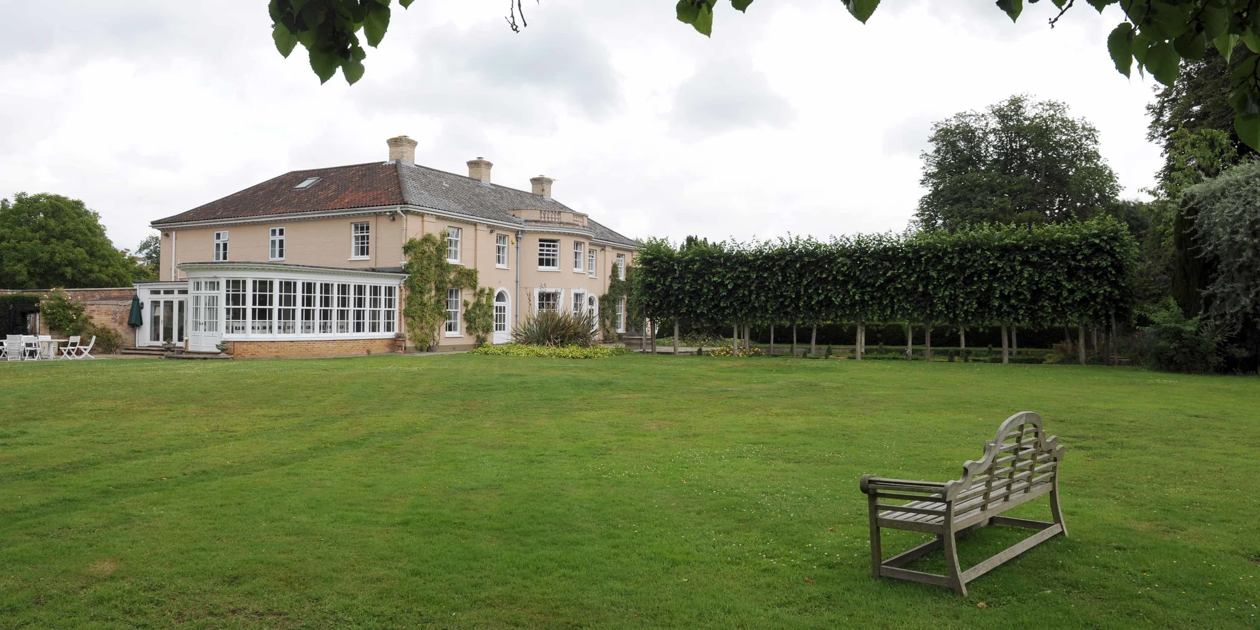 Large garden with outdoor seating and BBQ area