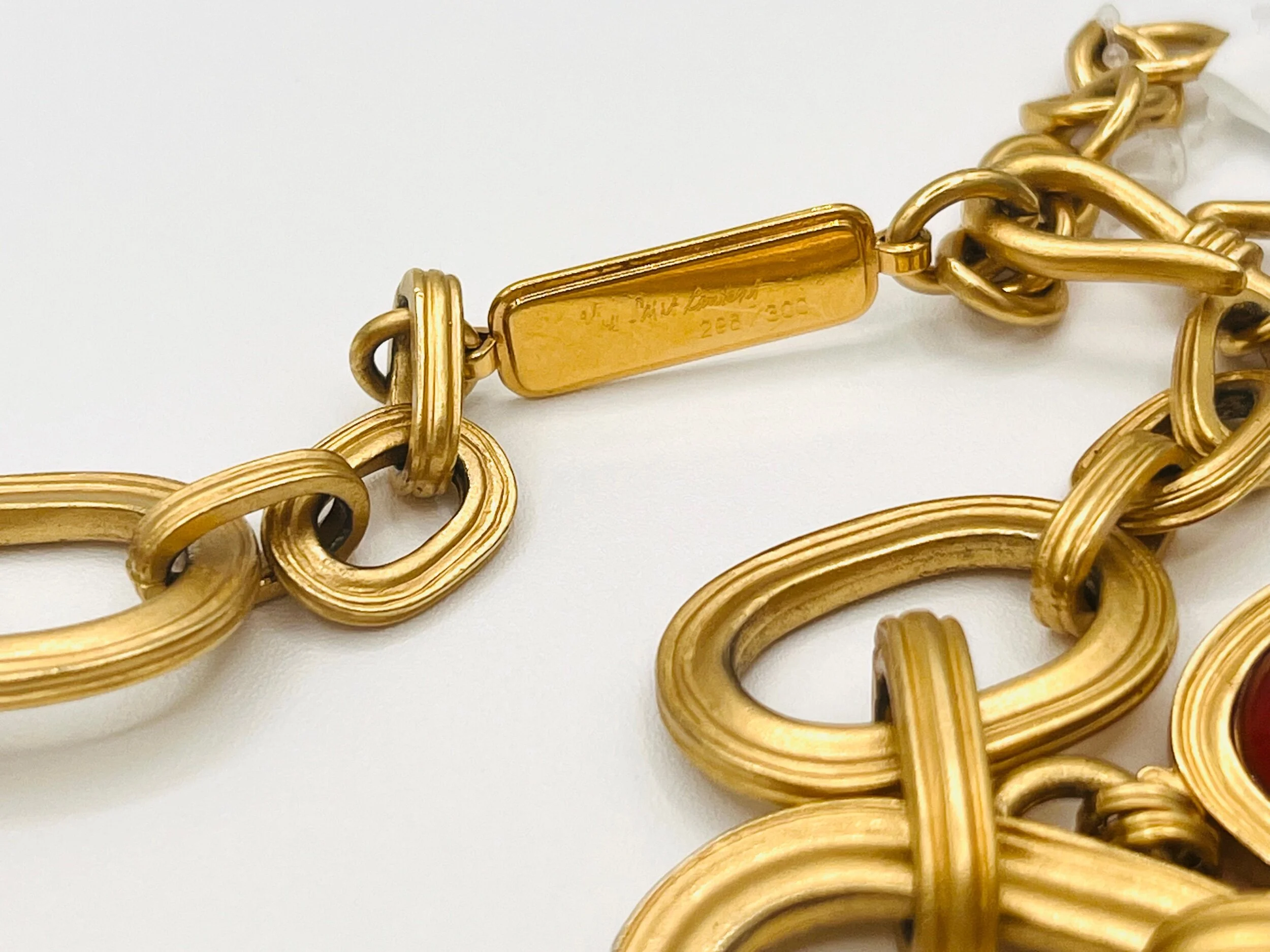 Detailed view of Vintage YSL Necklace showing logo