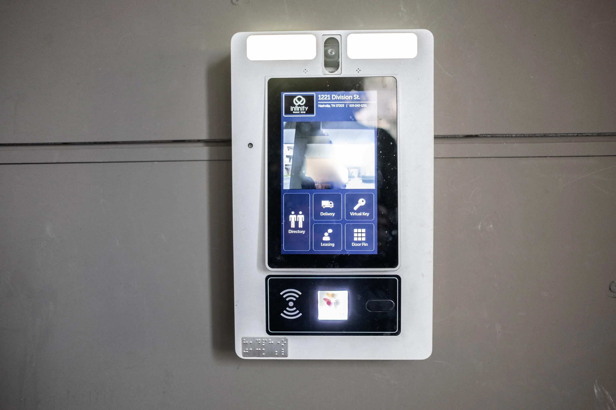 Touchscreen to enter building entrance.