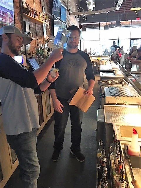Trey the new Bar Manager for Statesboro being coached by Wilmington's bartender, Andrew.