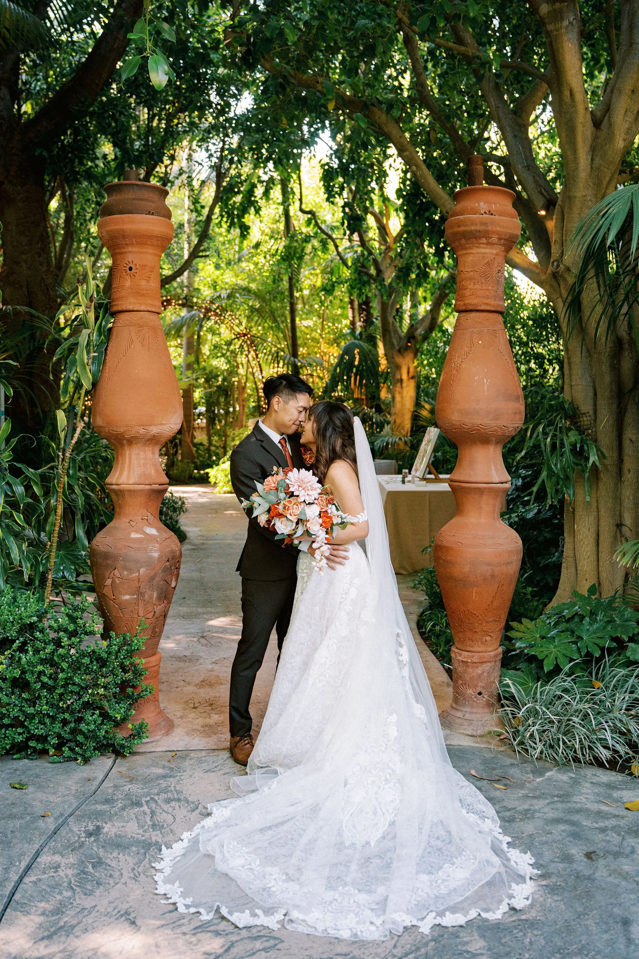 hartley-wedding-garden-bride-groom-terracotta-urns