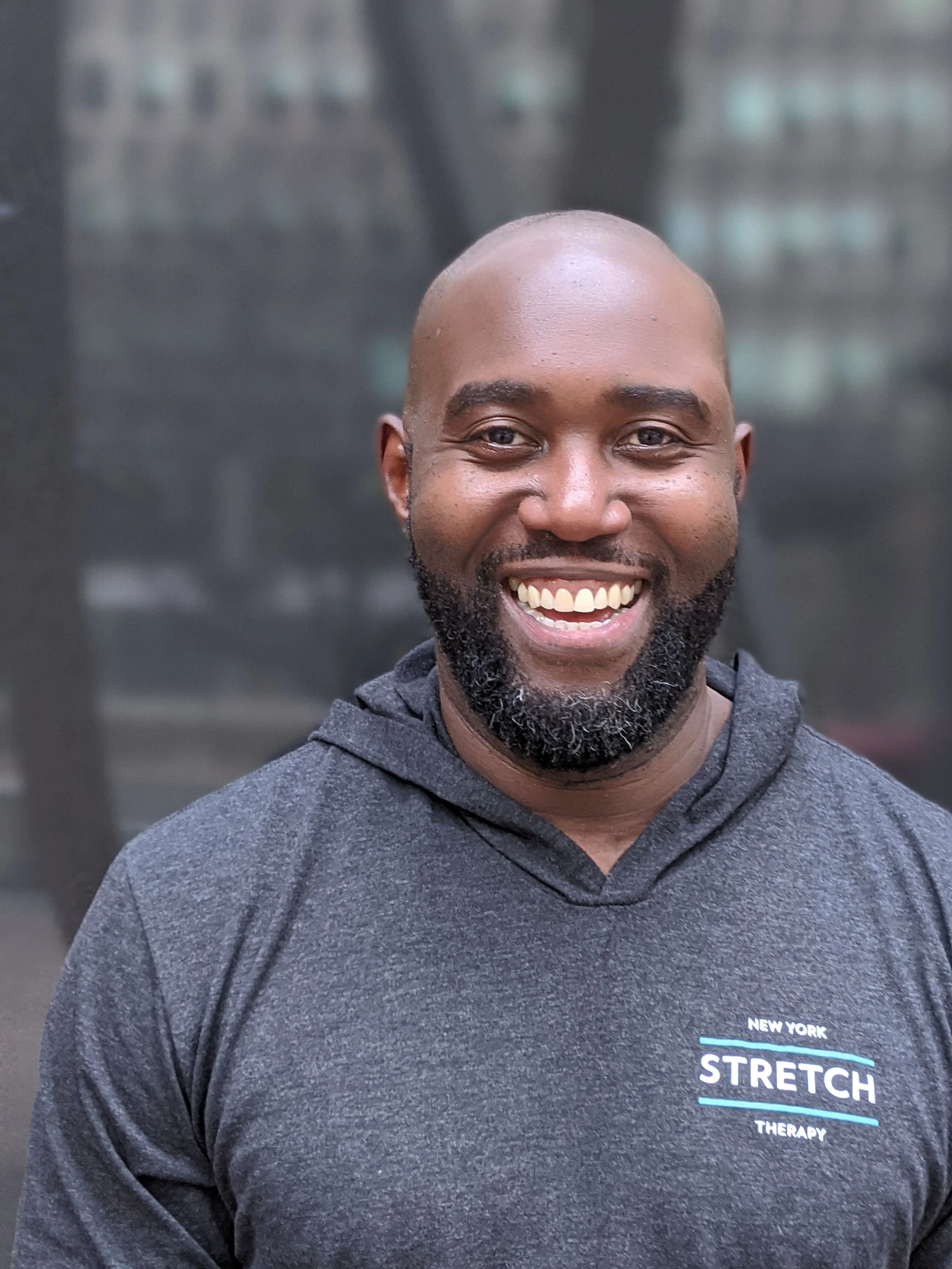 headshot of Michael Okech
