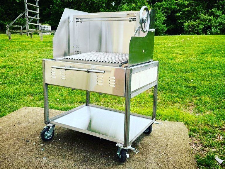 Here is our new Basico integrating our new Fire Cart system.

We&rsquo;ve got our Medium Clasico grill insert sitting inside our 40&rdquo; stainless steel, Fire bricked lined cart.  Topped off with our optional stainless steel wind guard. 

Cart is a