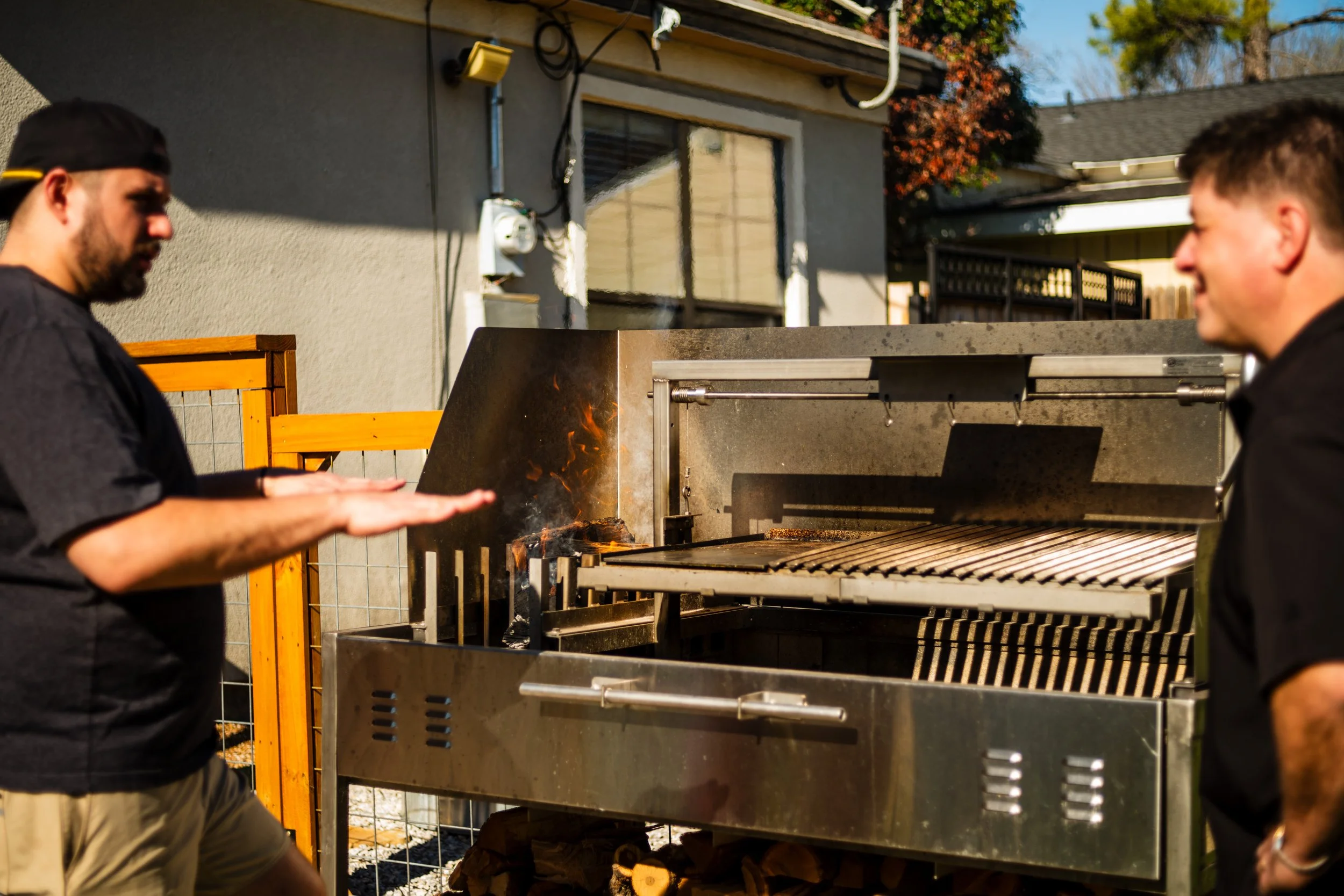 relaxing conversation around a wood-fired Argentine grill