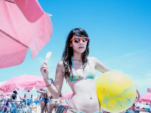 BRAZIL. Rio de Janeiro. 2011. Candy beach ball on Ipanema.