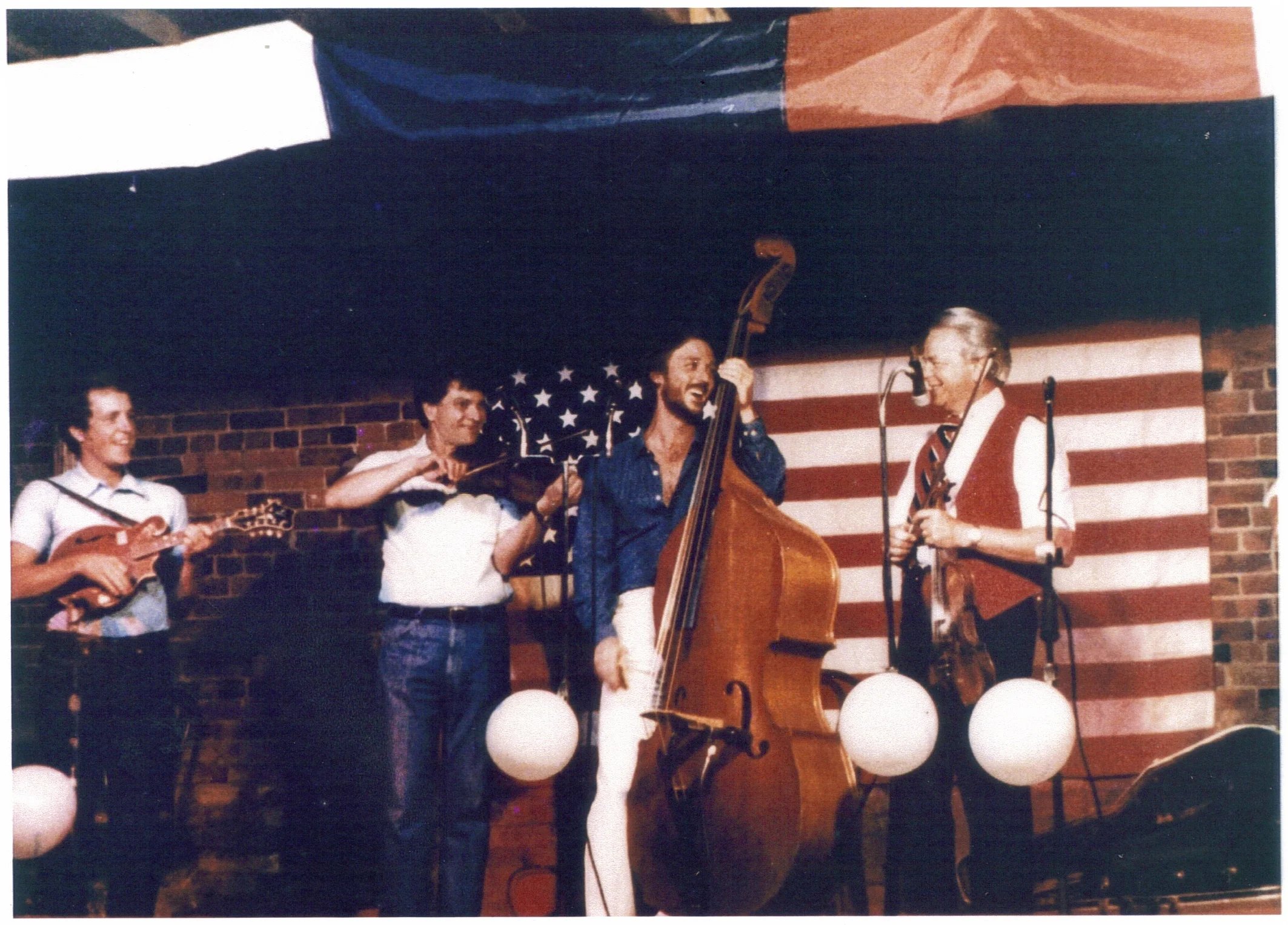 Arvil Freeman, second from left, playing fiddle with former Senator Robert Byrd, far right.