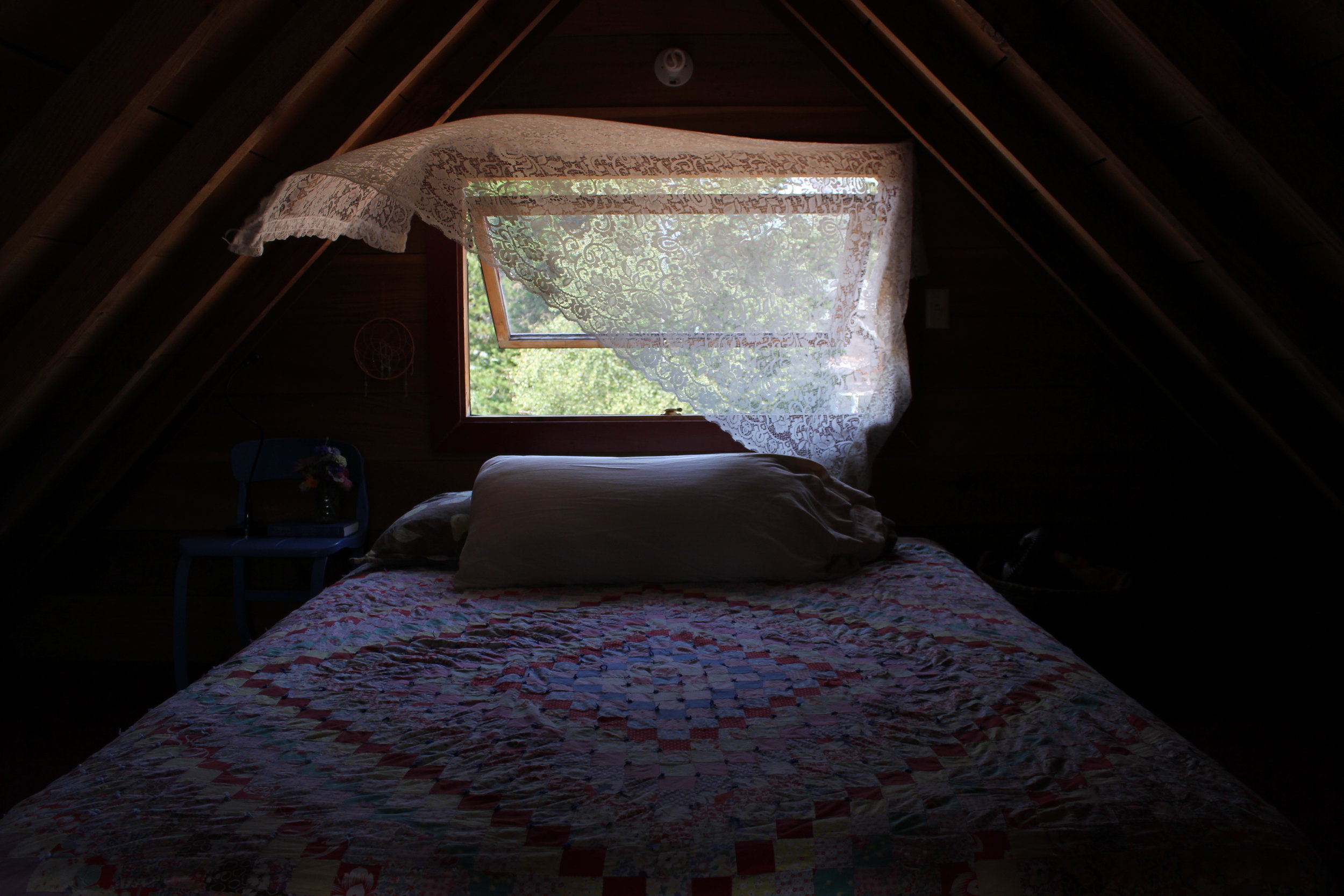 crochet curtain and quilt at plum nelli rustic boho cabin.JPG