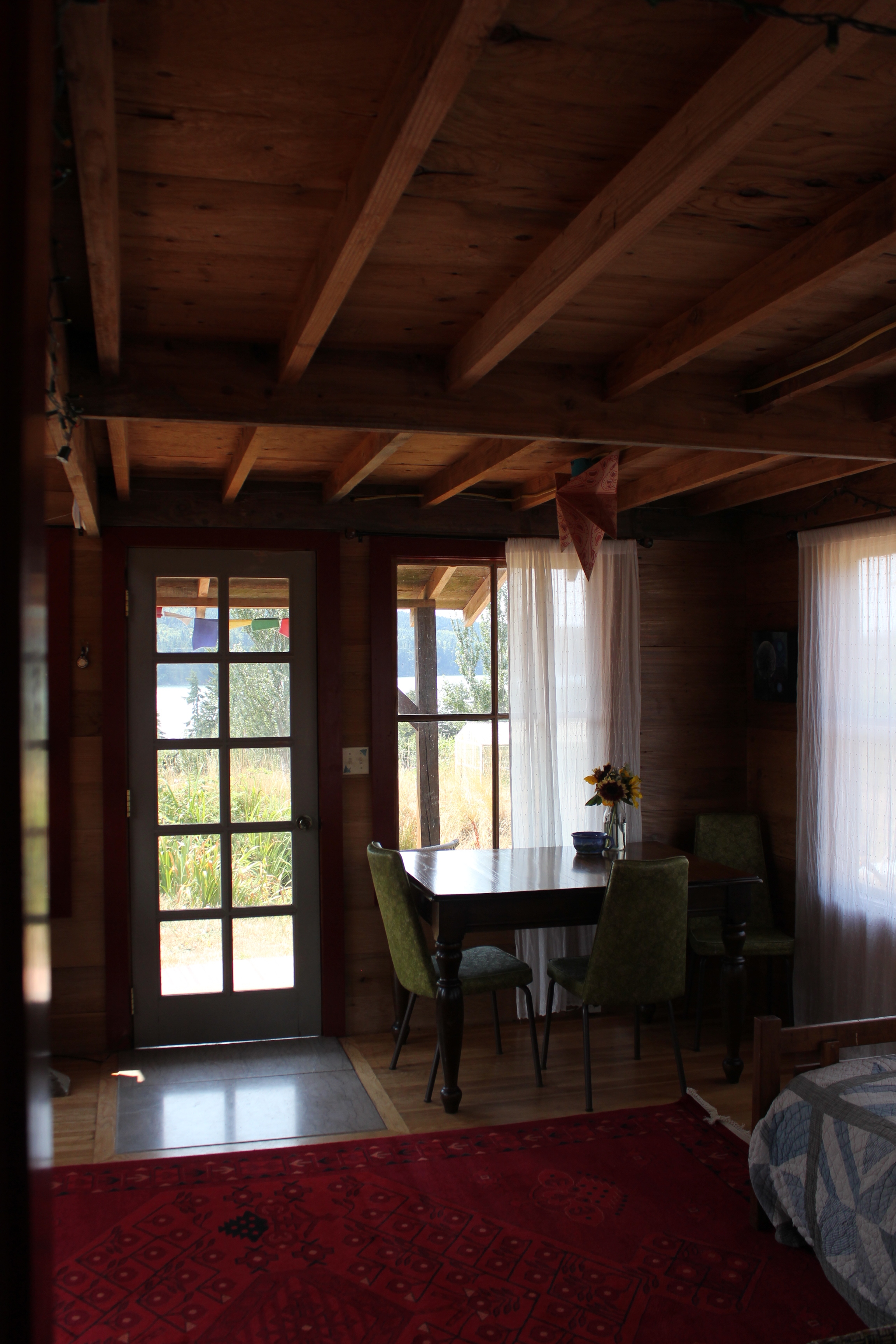 rustic cabin living dining room persian carpet.JPG