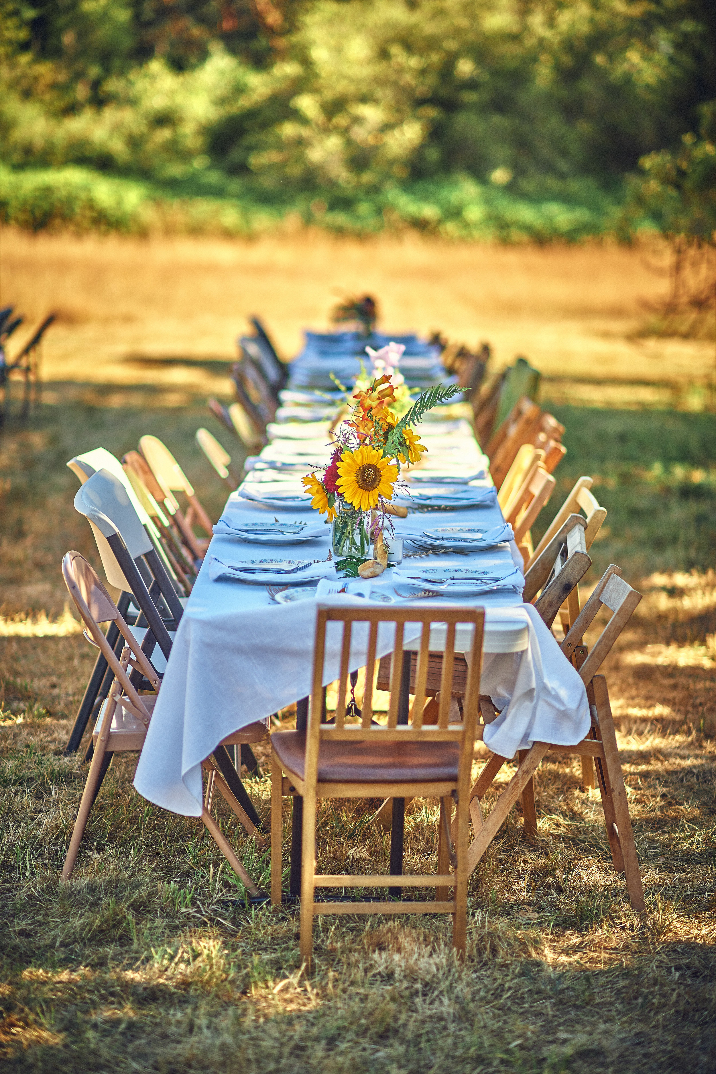 plum nelli outdoor dinner table settings for farm wedding.jpg