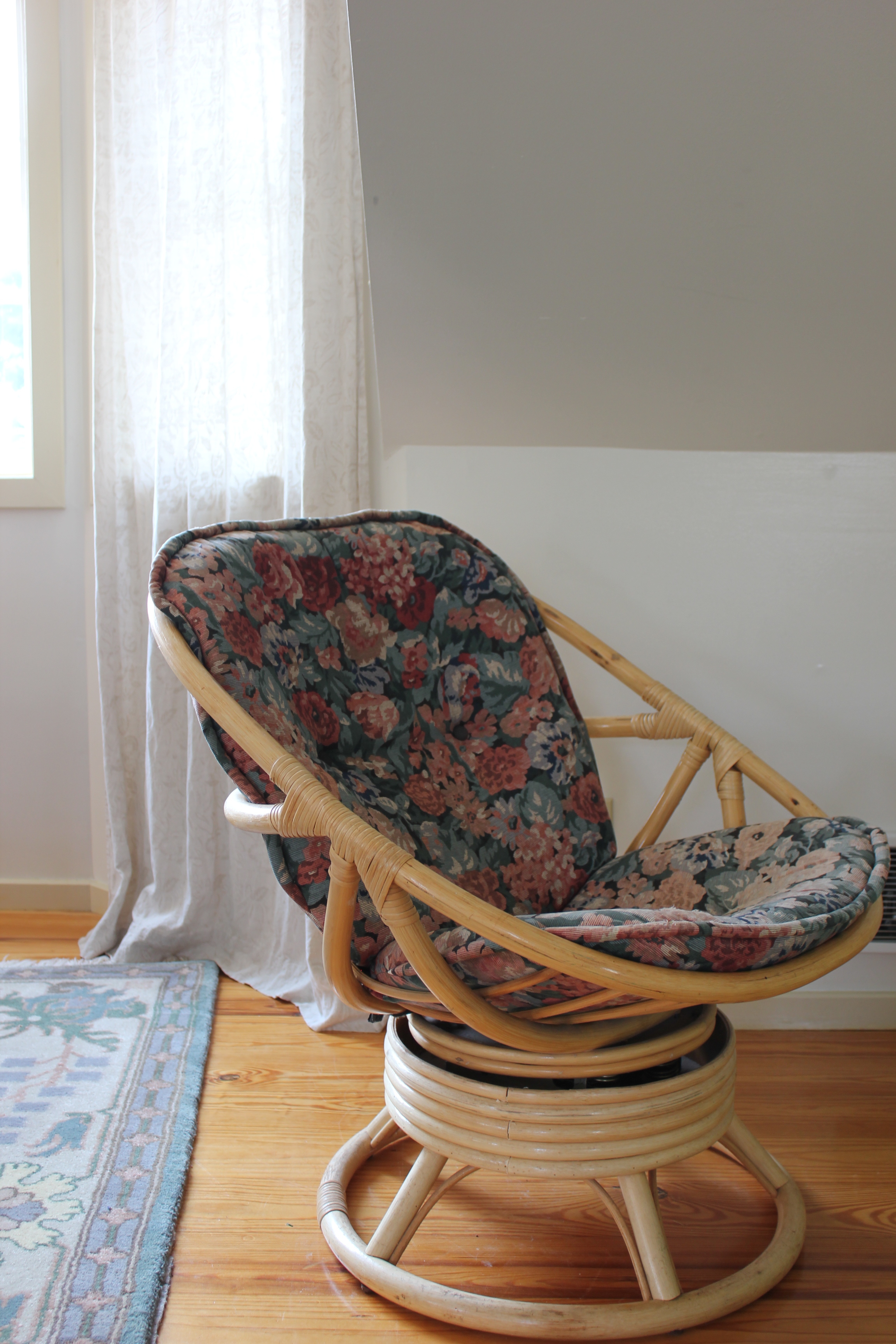 vintage rattan and floral rocking chair at plum nelli farm chic apartment rental airbnb.JPG