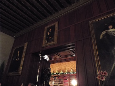 Entrance to Vanderbilt's Library with his portrait holding a book.