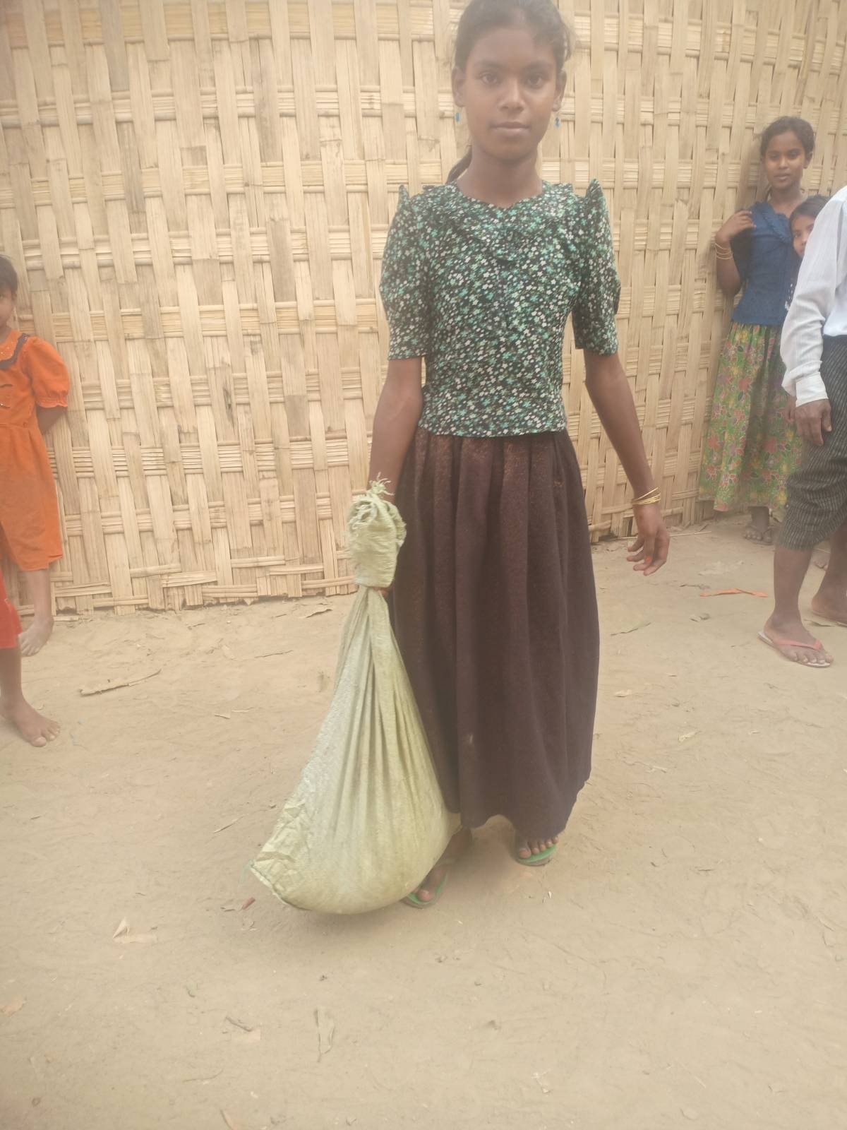 Impoverished children receiving supplies_.jpg
