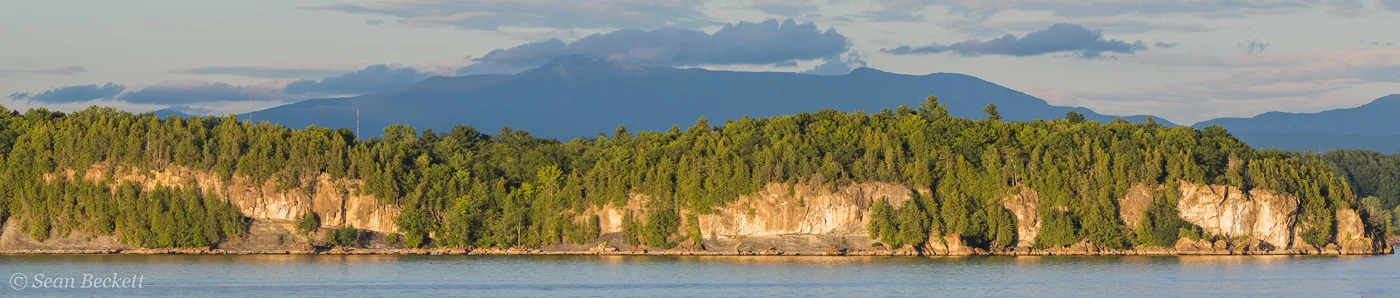 rock point cliffs and green mountains