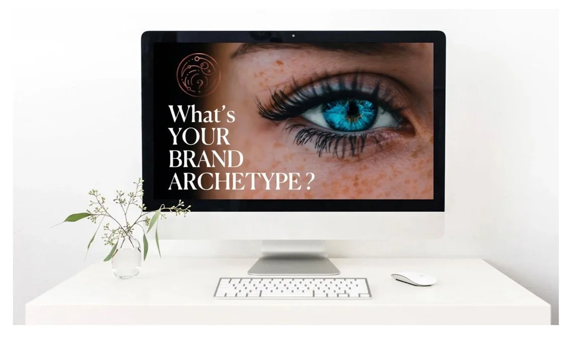 Computer on desk with a large eye