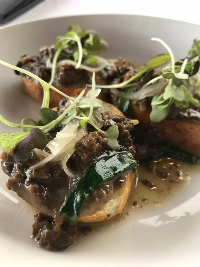 The Morillas y Rampas was definitely one of our favorites right off the bat. We are going to be 100% honest here, we had NO idea what morels or ramps were, but they were delicious. After some investigating, it appears that morels are edible fungus and ramps are wild onions-- who knew! We actually thought the morel was a meat of some kind. Though it sounds a bit odd, this dish is a melt in your mouth kind, with superb flavor all on top of a crispy crostini. These chefs really know what they're doing in the flavor combination department.
