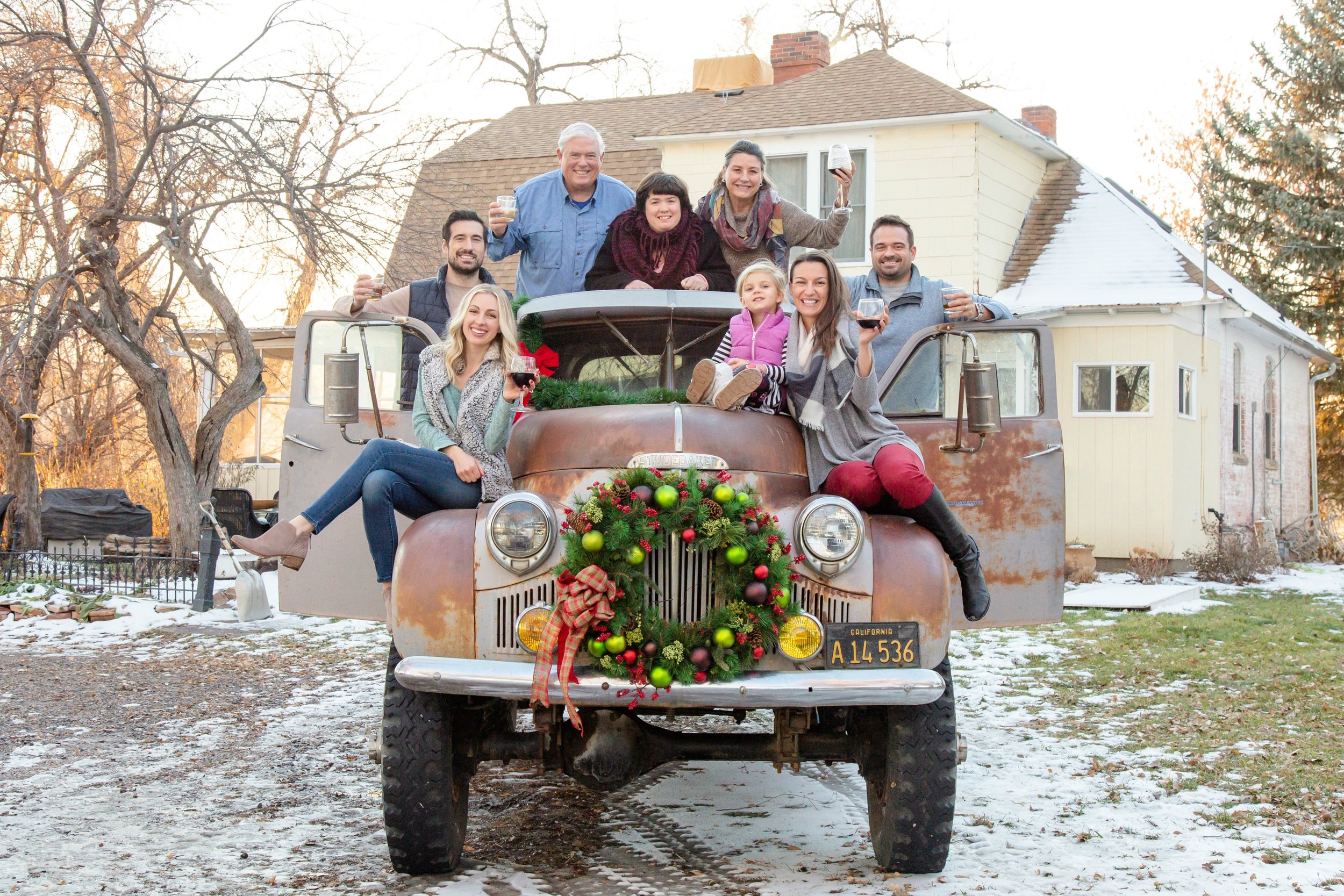 We took our family Christmas photo at the 1890s Farmhouse on their Studebaker!