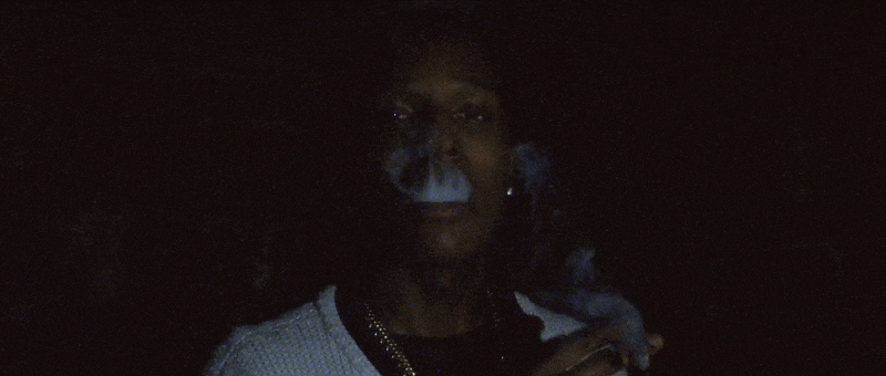 GIF, clip of ASAP Rocky smoking, holding picture of ASAP Yams in the music video for Nikes by Frank Ocean.