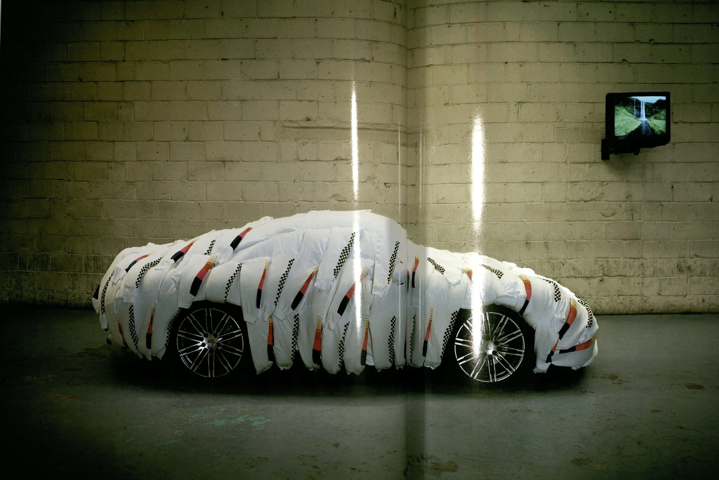 Frank Ocean photographs sculptures by Gary Card in “Television Waterfall”