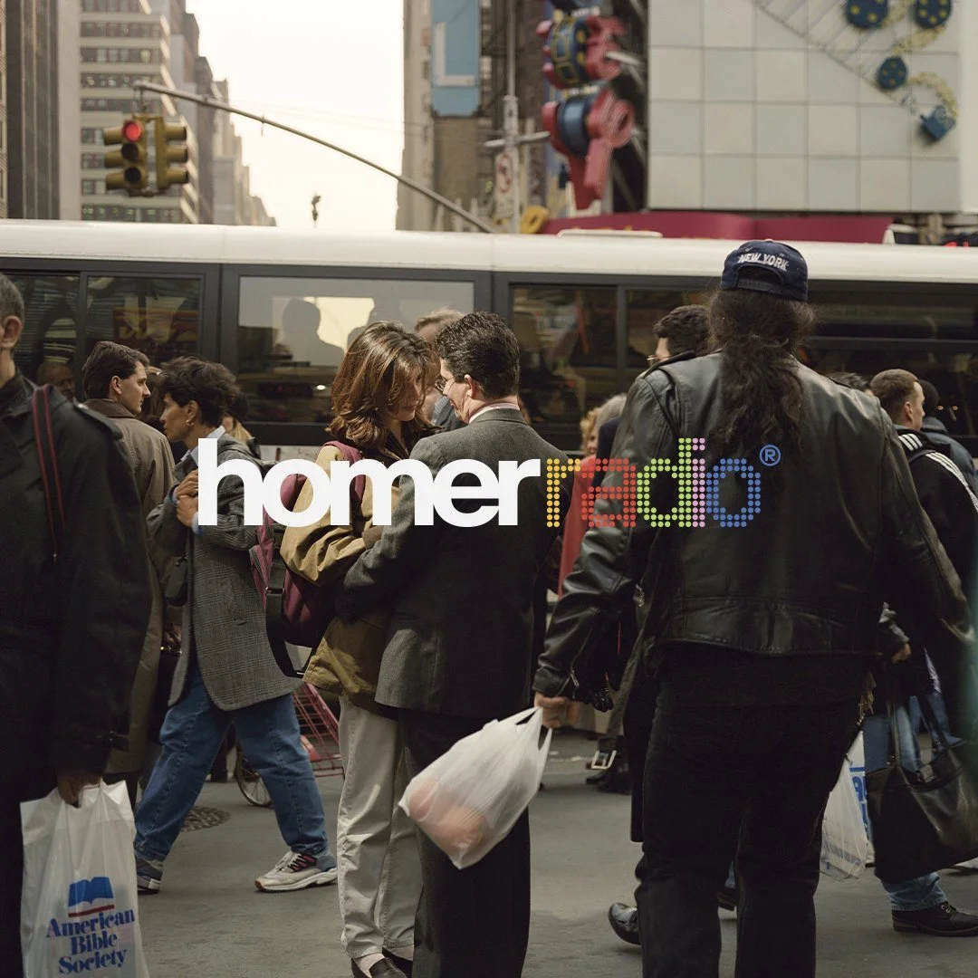 New York by Philip Lorca di Corcia. A photo of a couple locking eyes in a loving embrace while standing in the middle of a bustling New York City crosswalk.