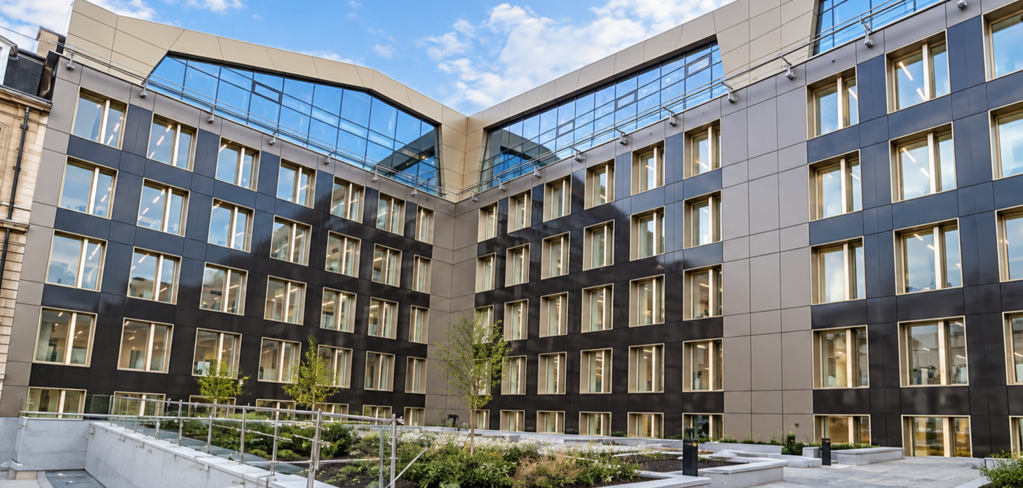 Modern Office Courtyard Under Blue Skies.png