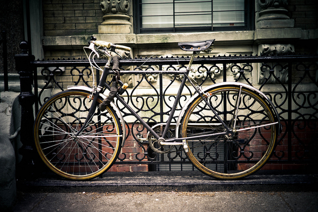 A locked bicycle in Amsterdam. Photo by Daniel Novello