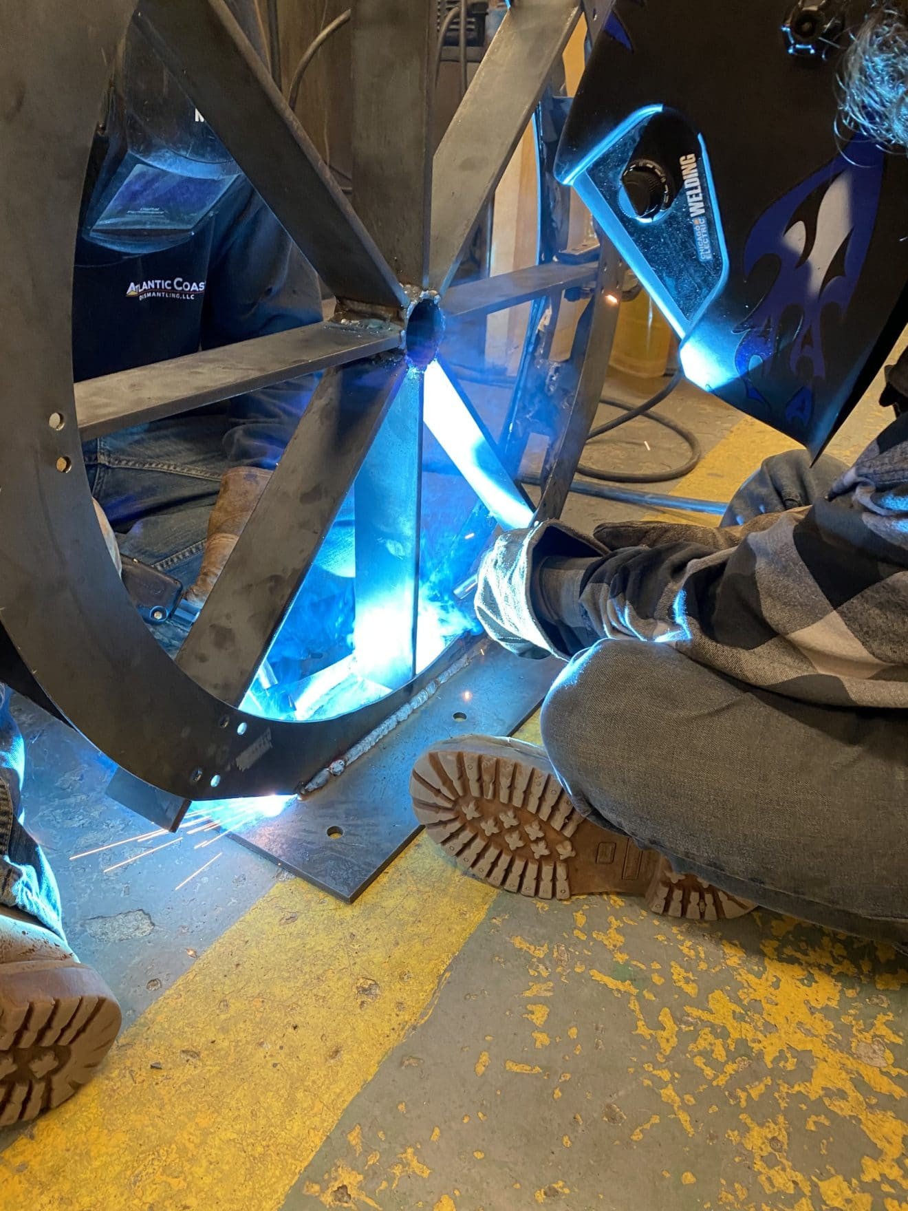 Students in Whitter Tech's Metal Fabrication:Welding pathway work on a water wheel bike rack design for the City of Amesbury..jpg