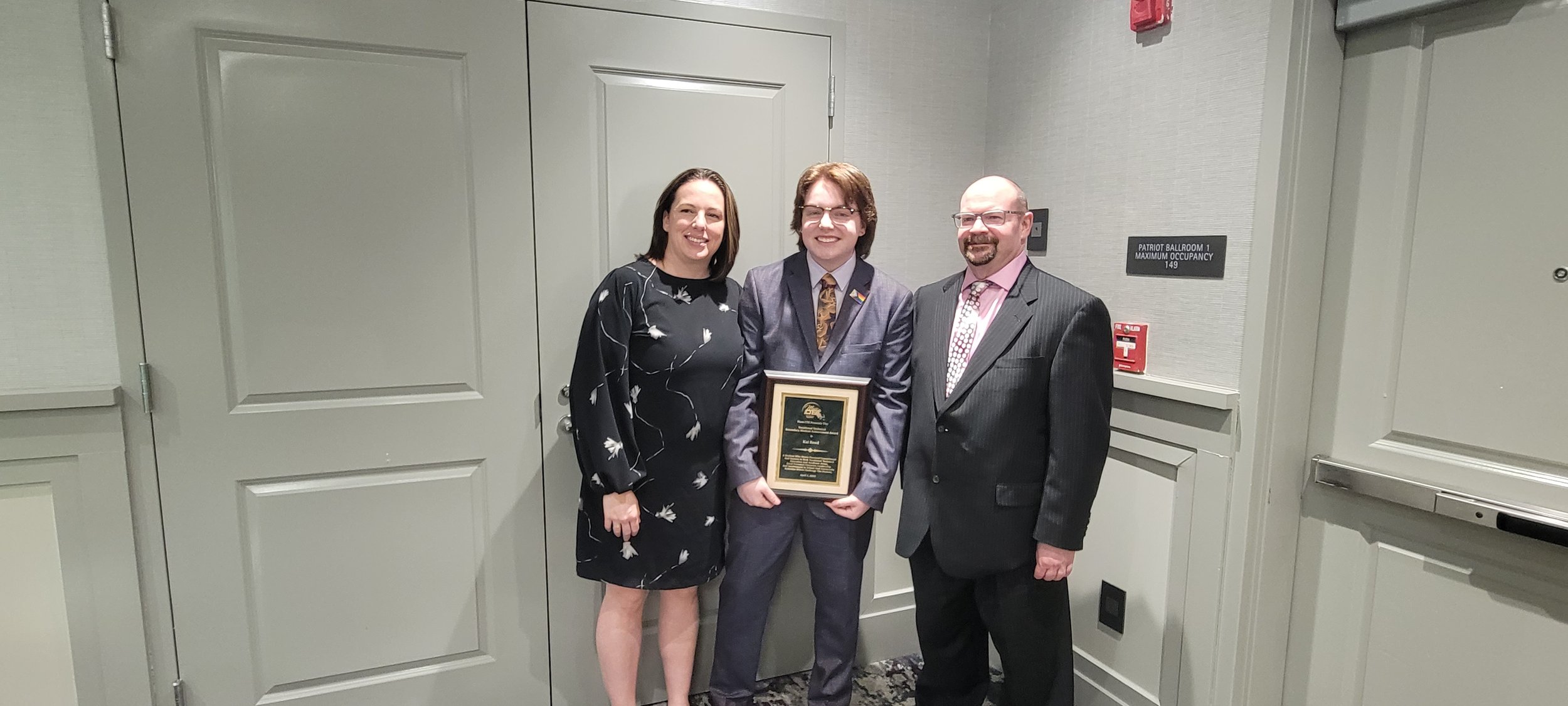  Kai Reed  (middle)   with mother Penny Reed and Electronics/Robotics Instructor Bob Beaton 