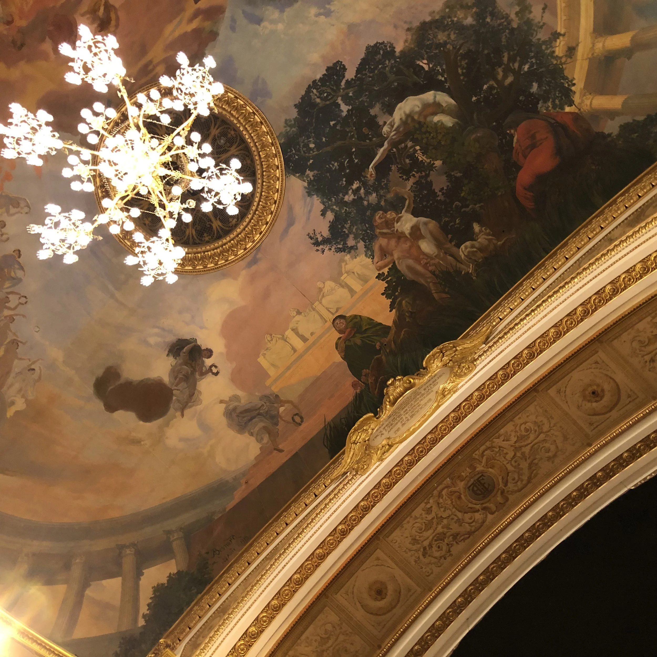 The elaborate ceiling and detail of the proscenium arch of the Salle Richelieu