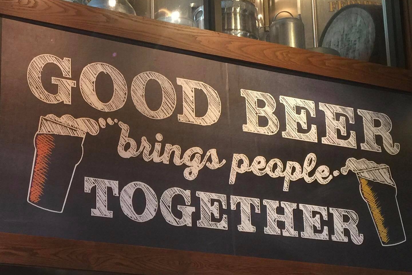 Sign reading: Good beer brings people together.