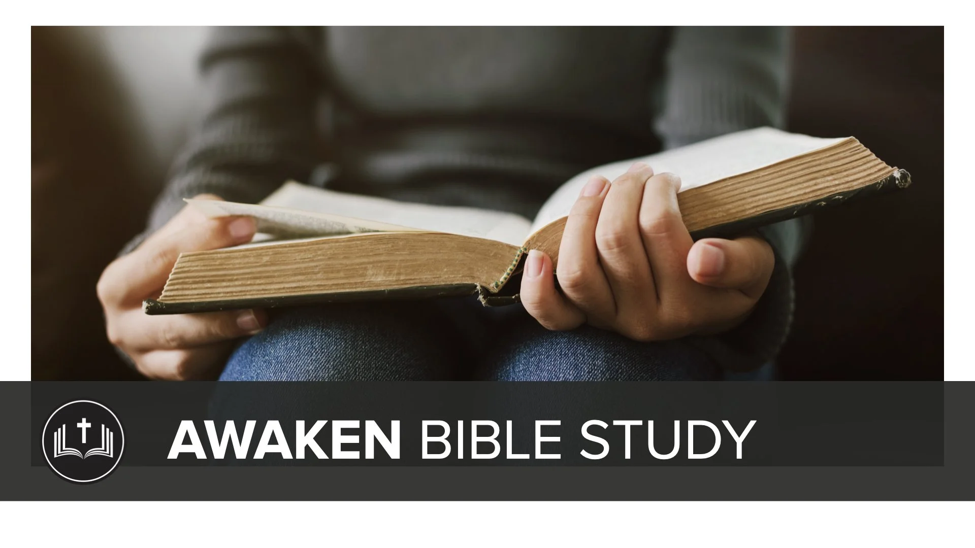 Person holding an open Bible with the text "AWAKEN BIBLE STUDY" and a church logo on a dark background at the bottom.