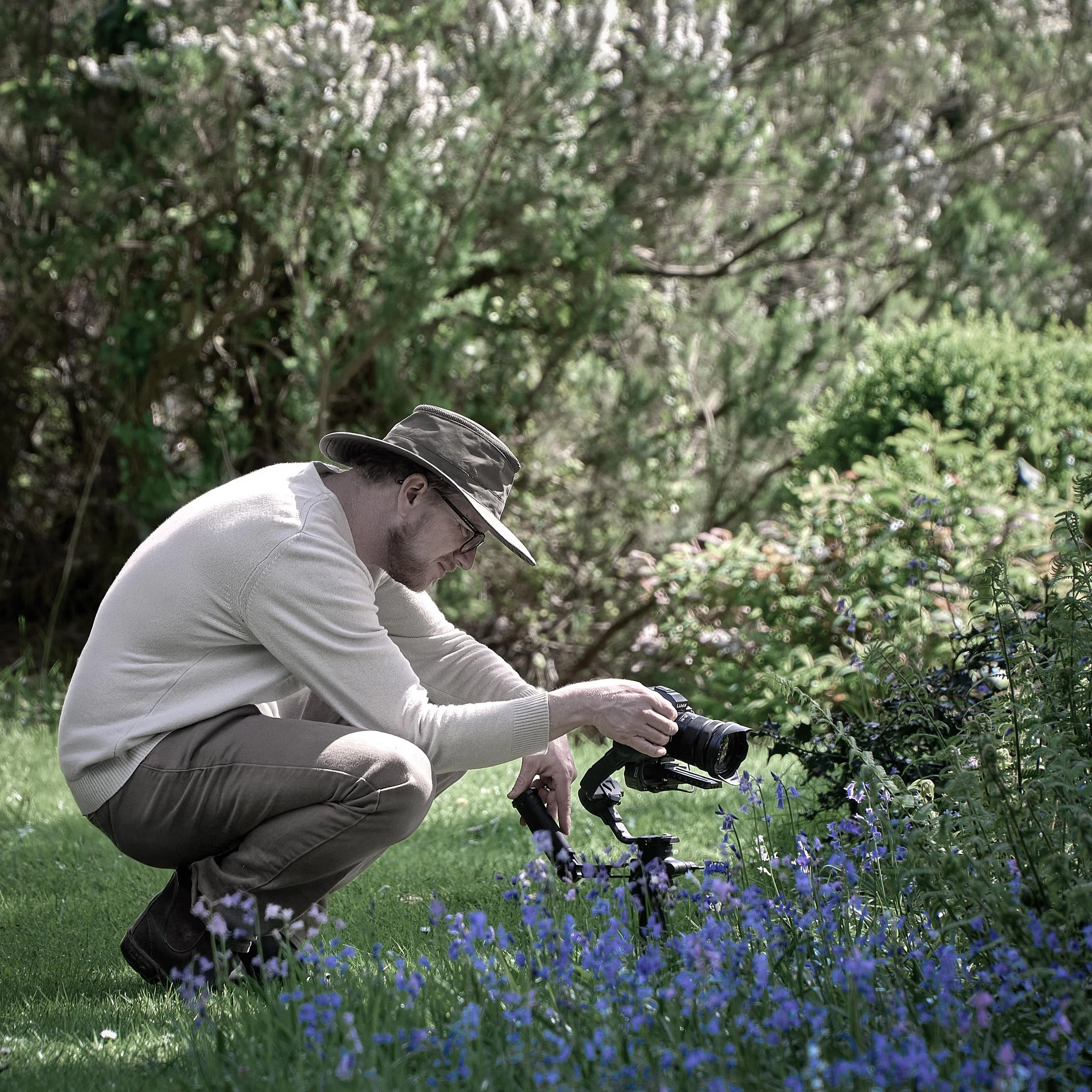 An image of Mark Hardy photographing a country garden