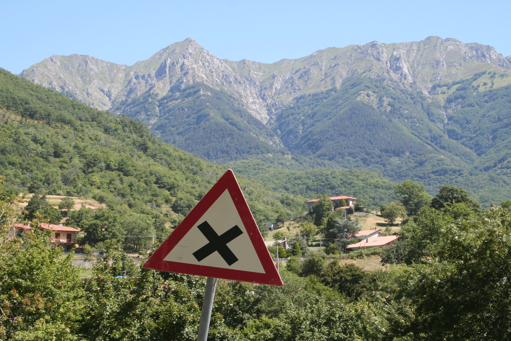 Red Triangle and Mountains Comano