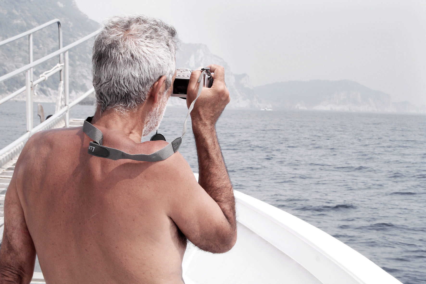 Man Taking Photograph on Boat, Cinque Terra